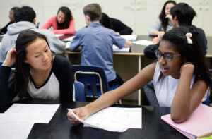 Students discuss work in chemistry class at Skyline High in Oakland.